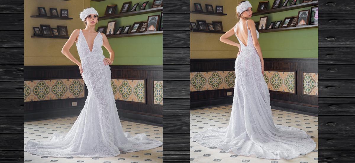 JENNY AMADOR: Con la inspiración de las grandes estrellas del cine de los años 20, este vestido elaborado en encaje blanco de corte asirenado y escote en V, es una oda a la sofisticación. Los detalles en 3D conforman el toque contemporáneo y la amplia cola es una apuesta actual en la moda nupcial. El tocado reafirma la añoranza del estilo de principios del siglo XX. MODELO: JULIANA OSORIO ANGULO/ MAQUILLAJE Y PEINADO: DARWIN CARVAJAL PARA DIEGO MOYA SALÓN/ LOCACIÓN: CENTRO COMERCIAL LA SERREZUELA/FOTOS: FERNANDO PARRA LÓPEZ